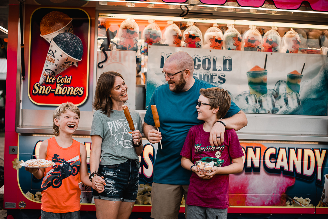 Omaha family having fun at the Sarpy County Fair during storyteller photographer session with Melissa Lindquist photographer.